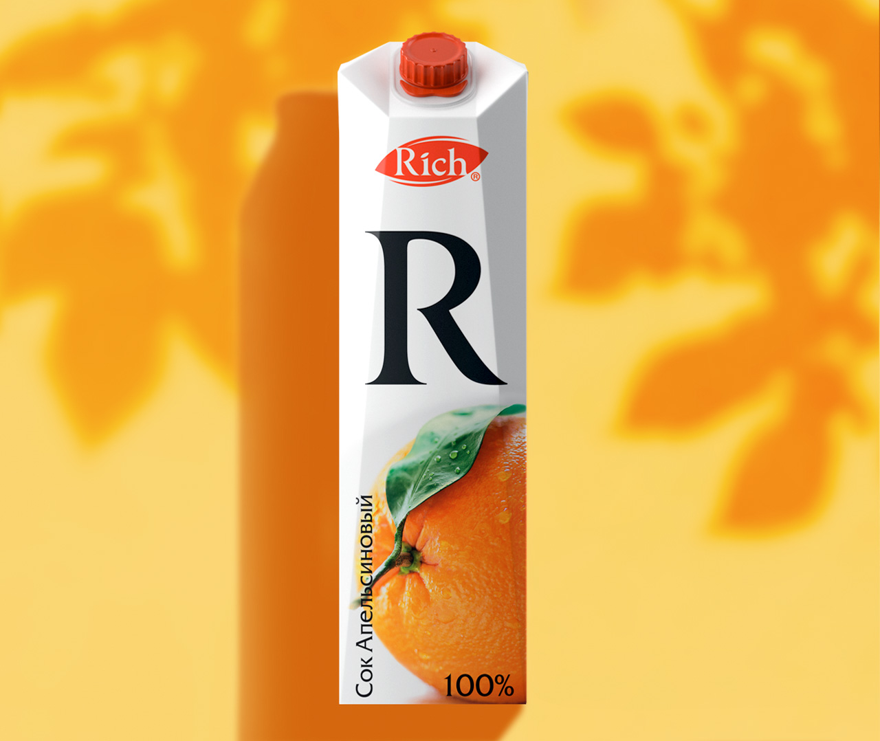 Картонная упаковка апельсинового сока Rich с красной крышкой, на которой изображены большая буква R, изображение апельсина, русский текст и фирменный стиль Soldis на желтом фоне с тенью оранжевого листа.
